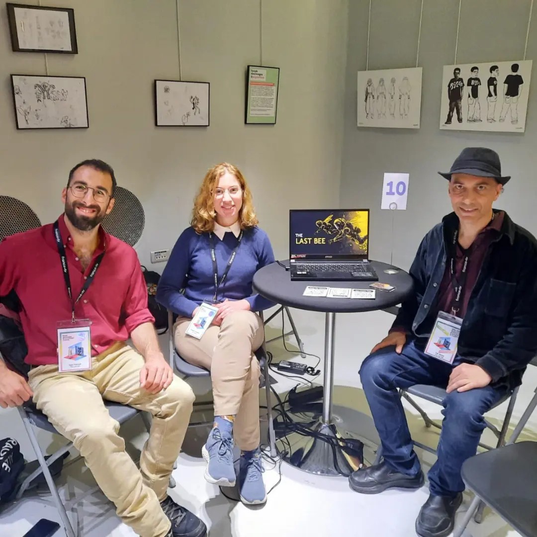 The Last Bee at NewImages Festival 2024 — booth photo with concept art on the wall